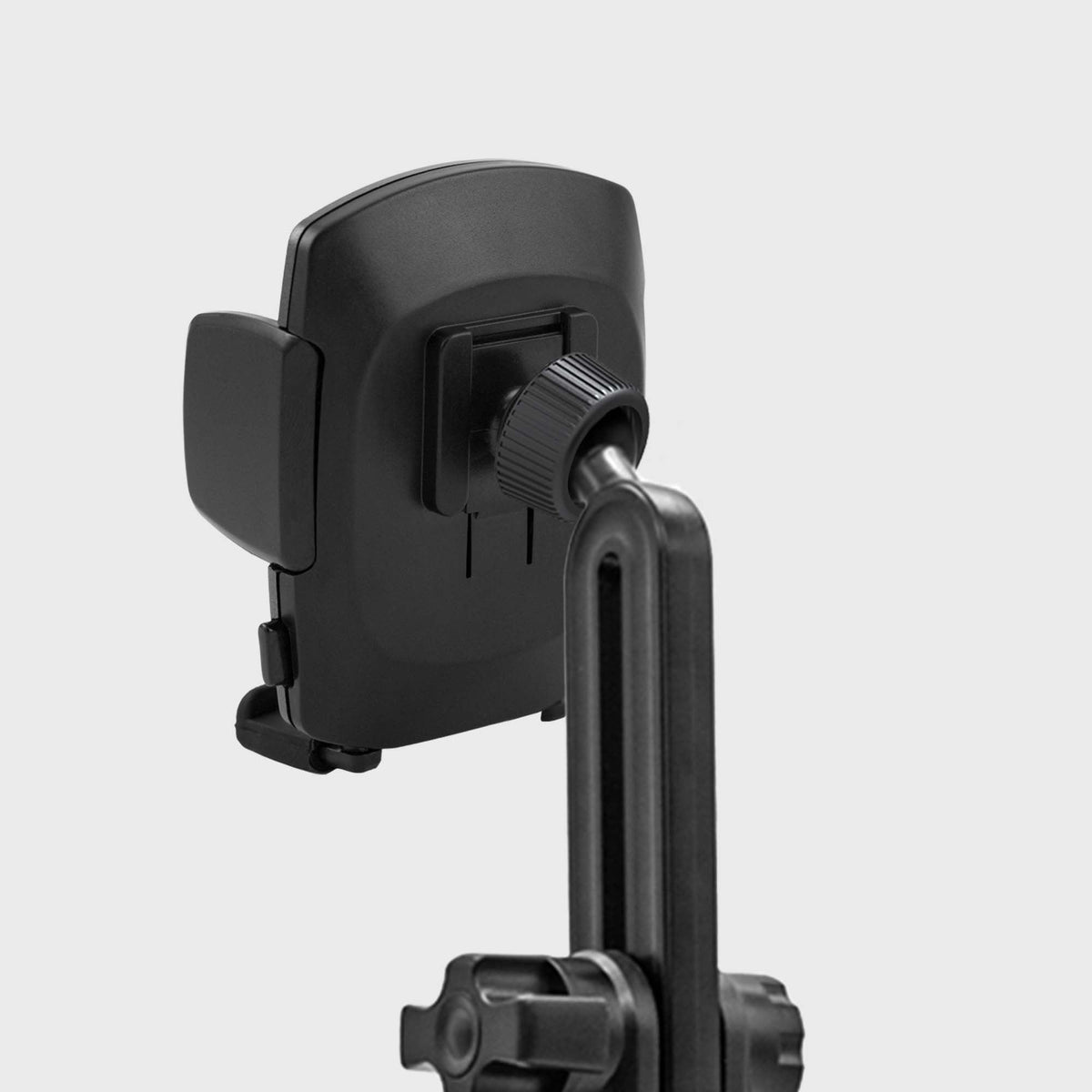 Car mount with easy-twist lock and adjustable cradle, mounted on vehicle dashboard with smartphone in place, showing quick release feature