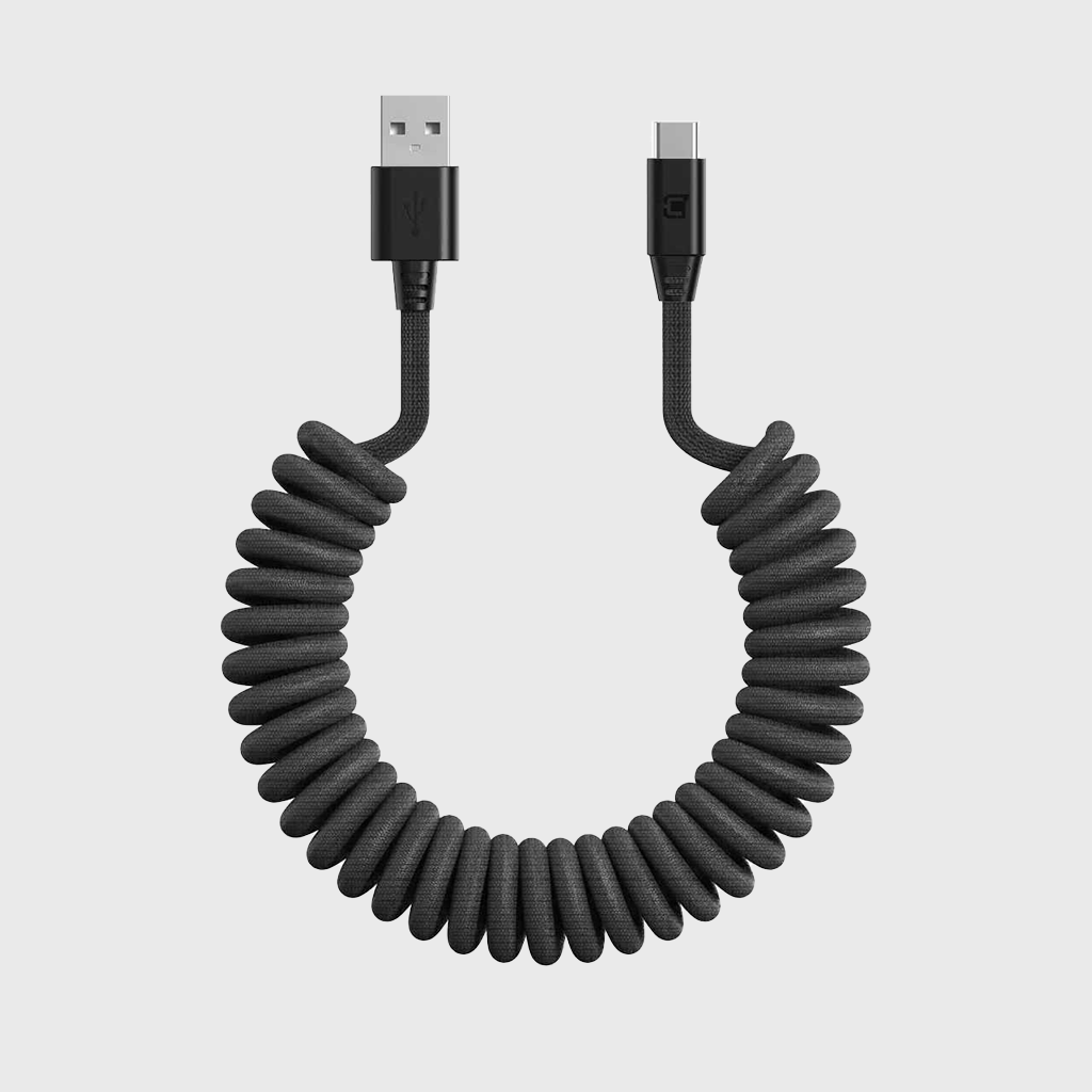 Black coiled USB-A to USB-C charging and sync cable with braided nylon exterior, compact connectors, and SKU: C0520-30