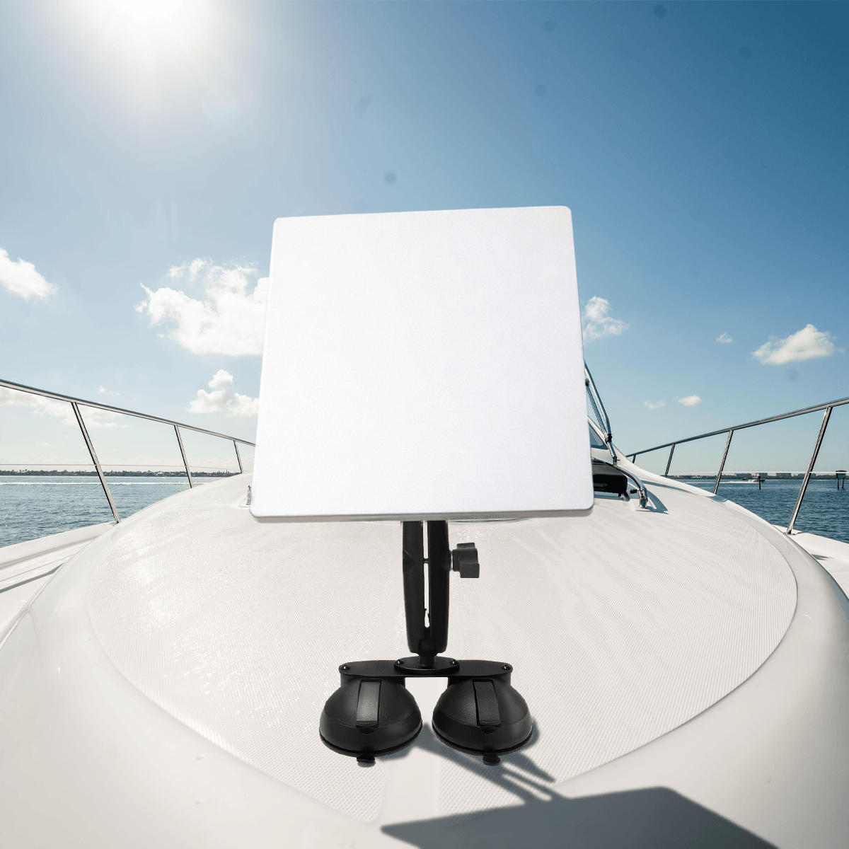 Starlink antenna mounted on a boat with a white dual suction cup mount, clear sky, marine environment, portable satellite setup